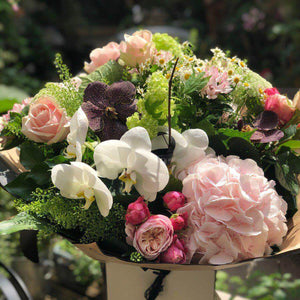 orchids, roses and hydrangeas in a bouquet 