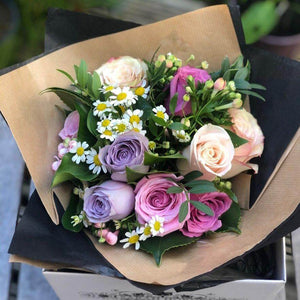 pink, lilac and cream roses in a petite bouquet