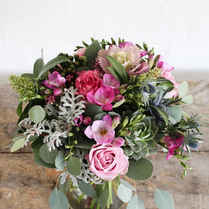 pink roses and freesias and foliage bouquet