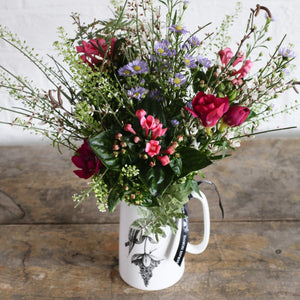 cerise and red seasonal fl;owers in bone china jug.