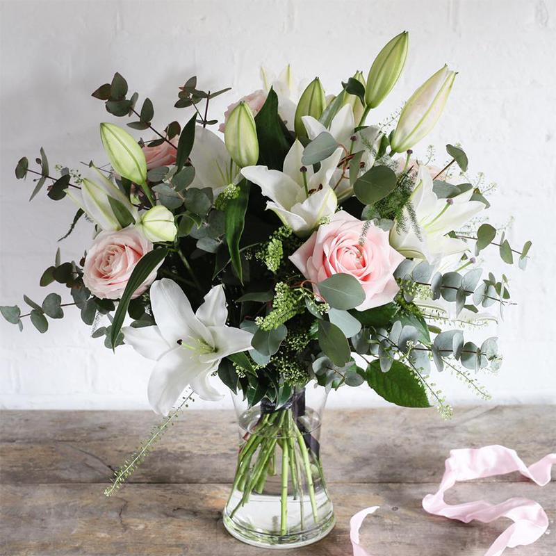 Rose and Lily bouquet in a vase.