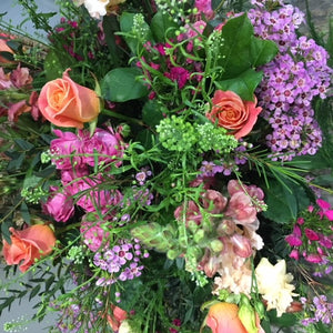 peach and lilac flowers for a plinth display.