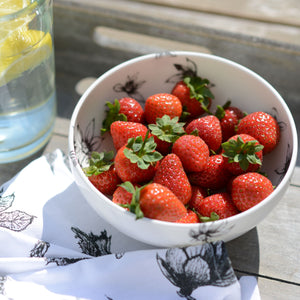 china bowls with blossom decorations and filled with strawberries