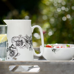 orchid  design jug with bowl of fruit