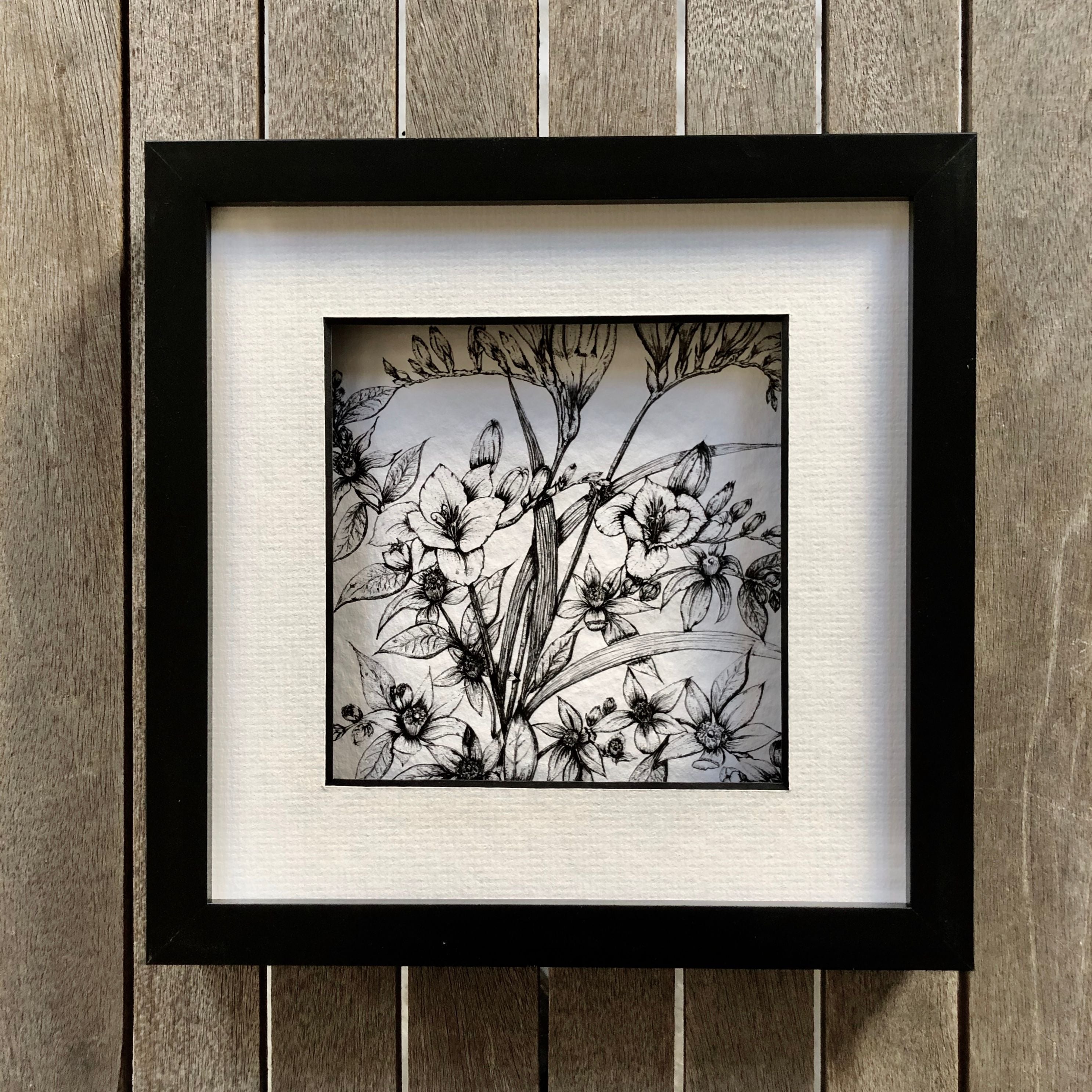 Detailed illustration of Freesia flowers and jasmine in a black frame. 