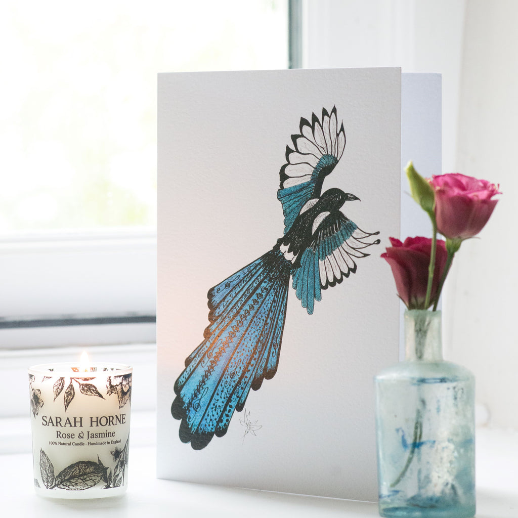hand drawn greeting card of a magpie with teal detailing