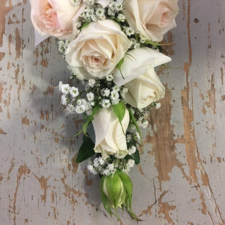 Pink and cream rose corsage