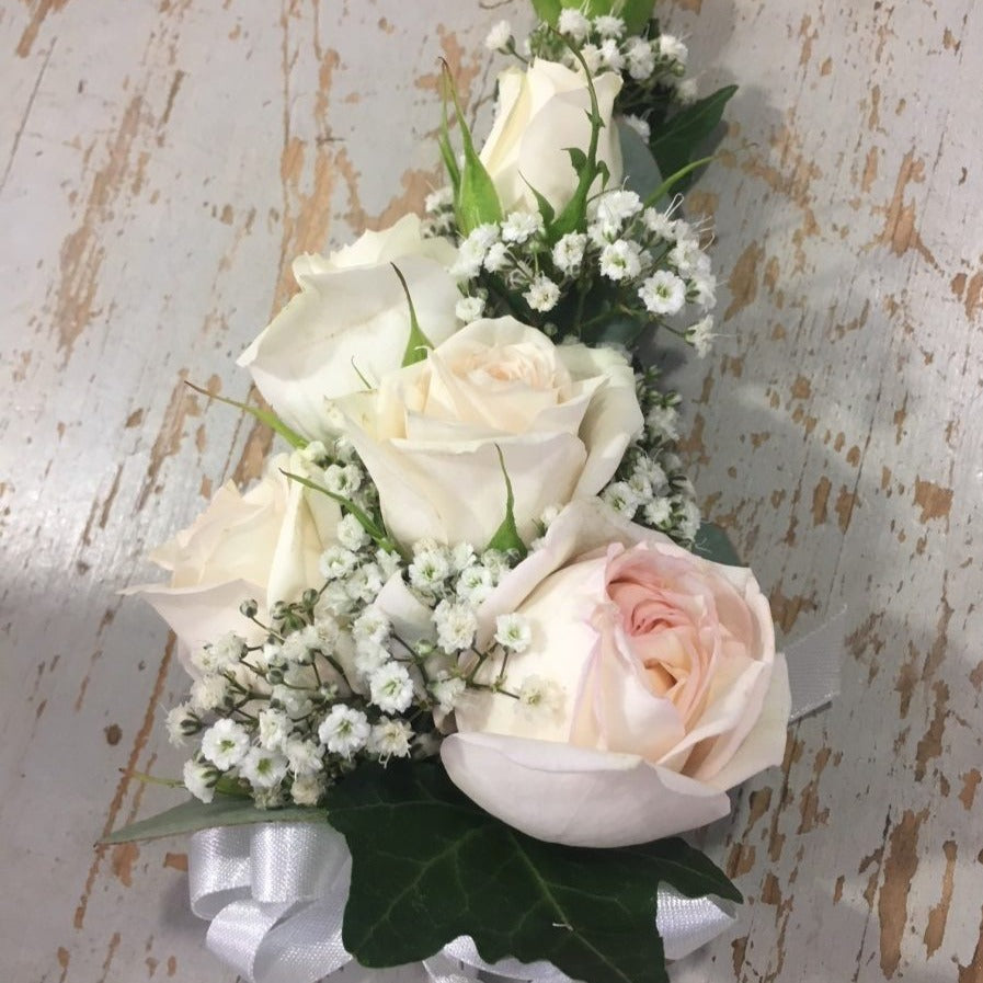 Pink and cream rose corsage