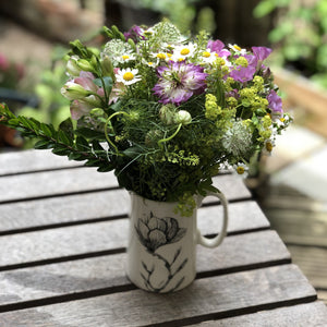 the magnolia design jug with flowers 