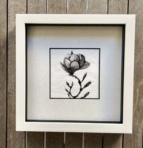 magnolia drawing in a white frame