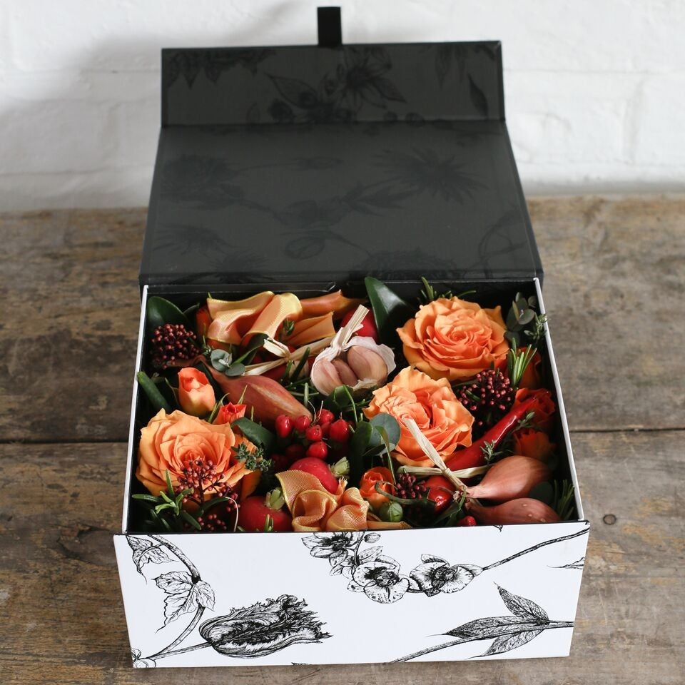 peach and copper tone flowers in a gift box.