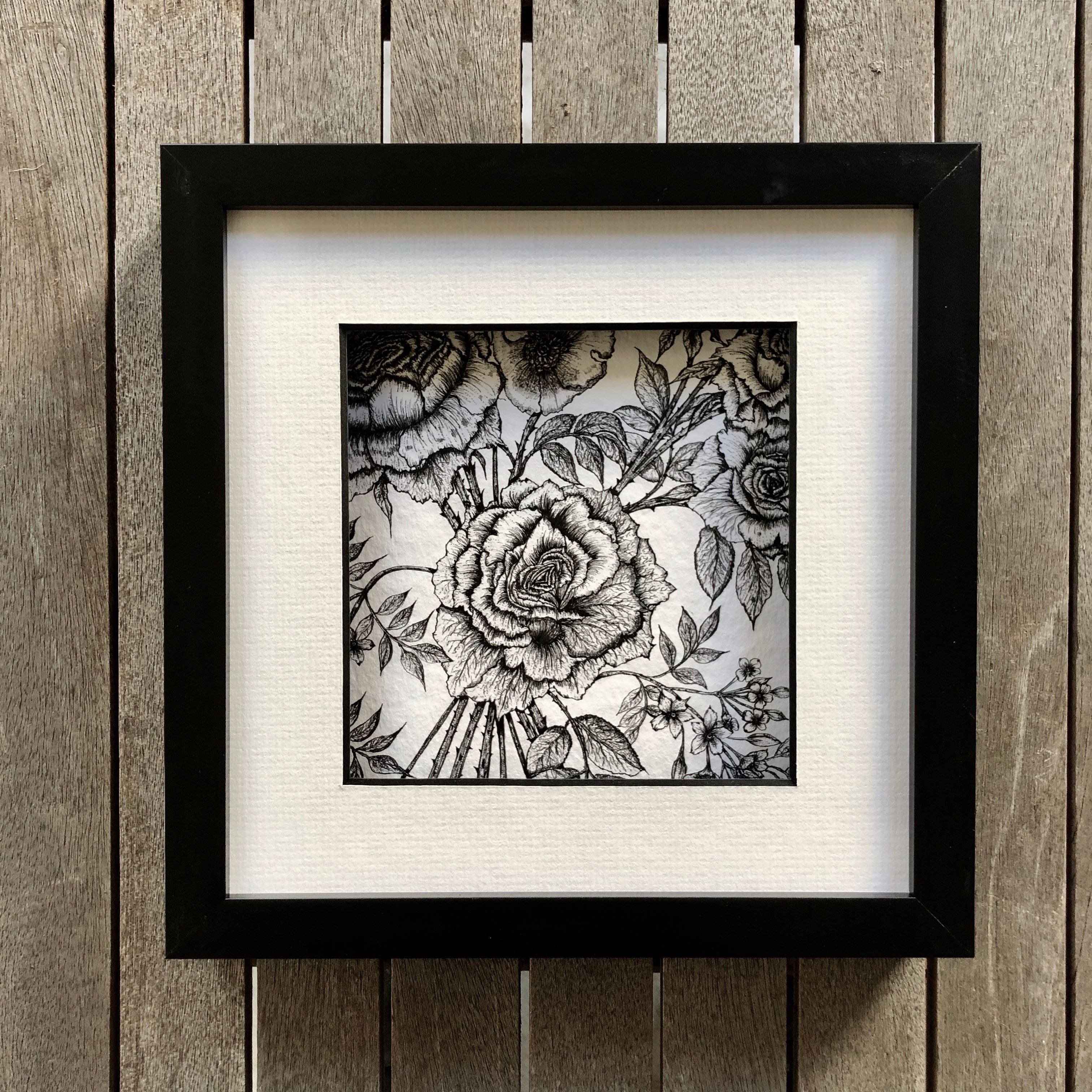 detail rose and jasmine print in a black frame