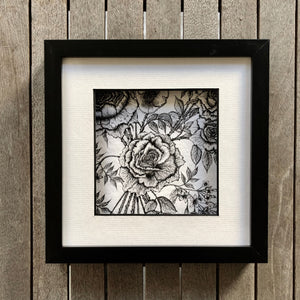 detail rose and jasmine print in a black frame