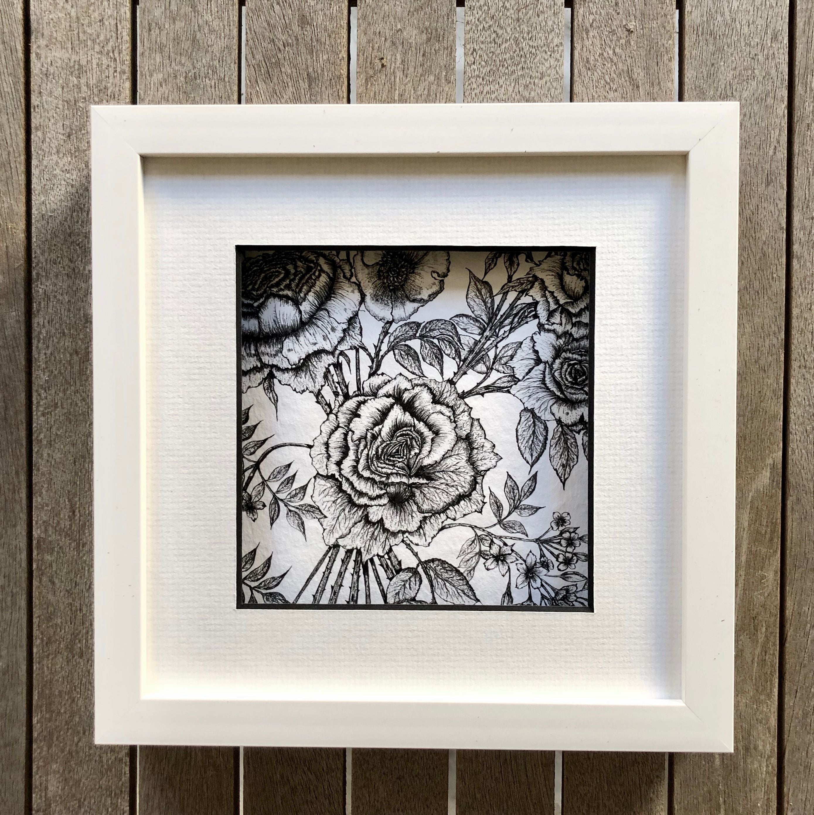 detail rose and jasmine print in a white frame
