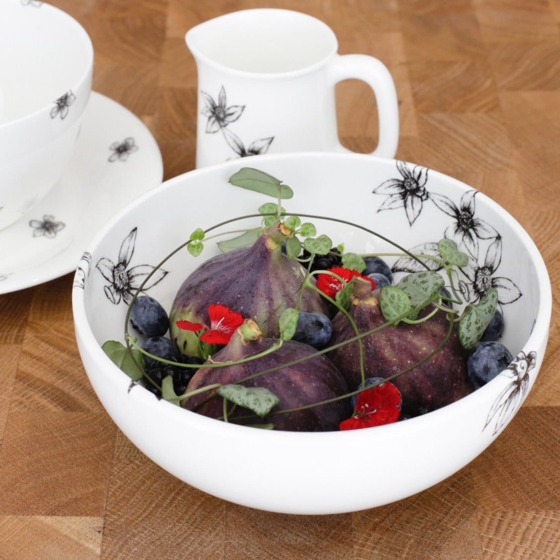 dessert bowl shown with cream jug and cup and saucer