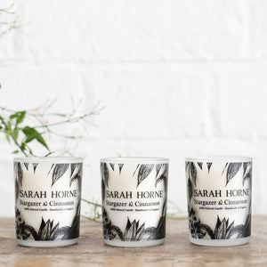 a trio of freesia and orange blossom votive candles 