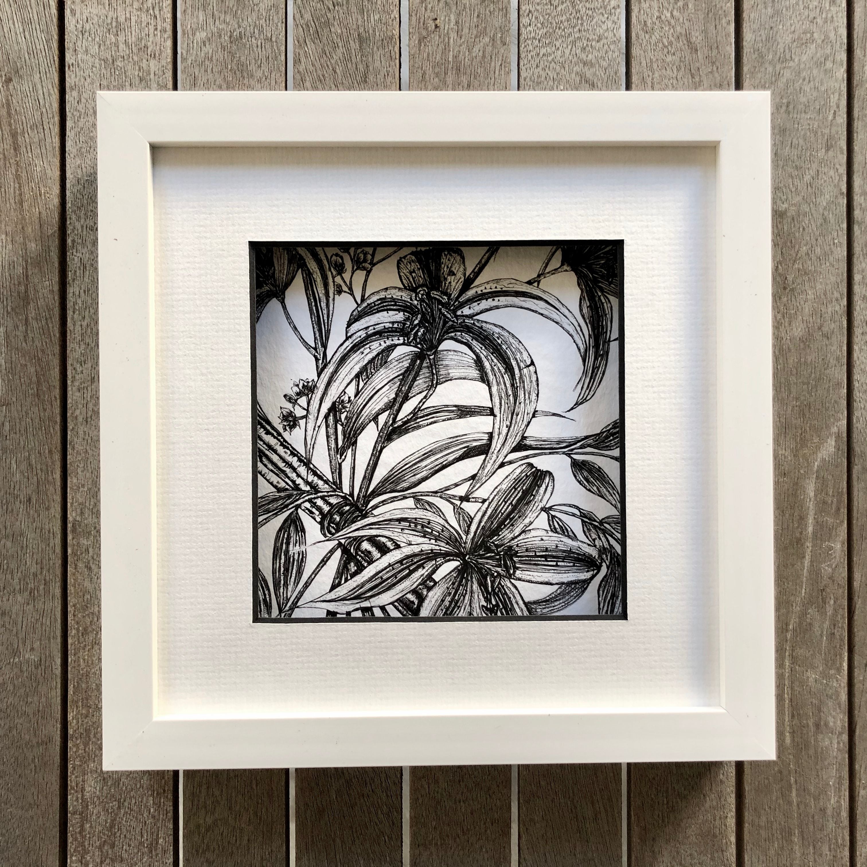 Detailed illustration of stargazer lilies and cinnamon in a white frame.