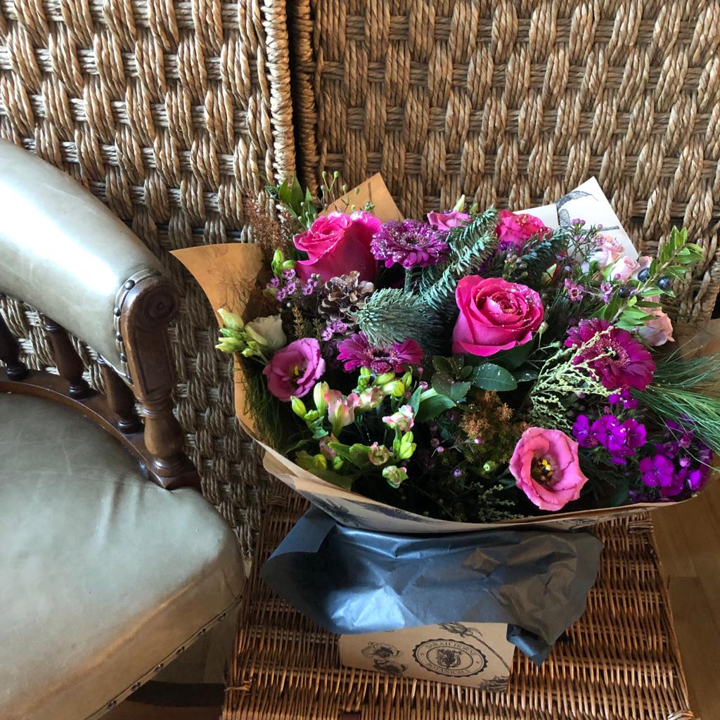 pink roses and purples flowers sprinkled with glitter.