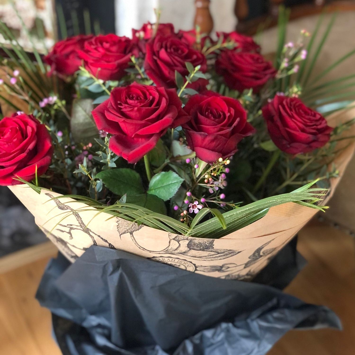 Long stemmed red roses with gift wrap