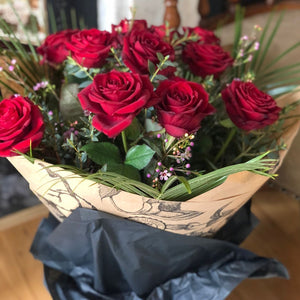 Long stemmed red roses with gift wrap