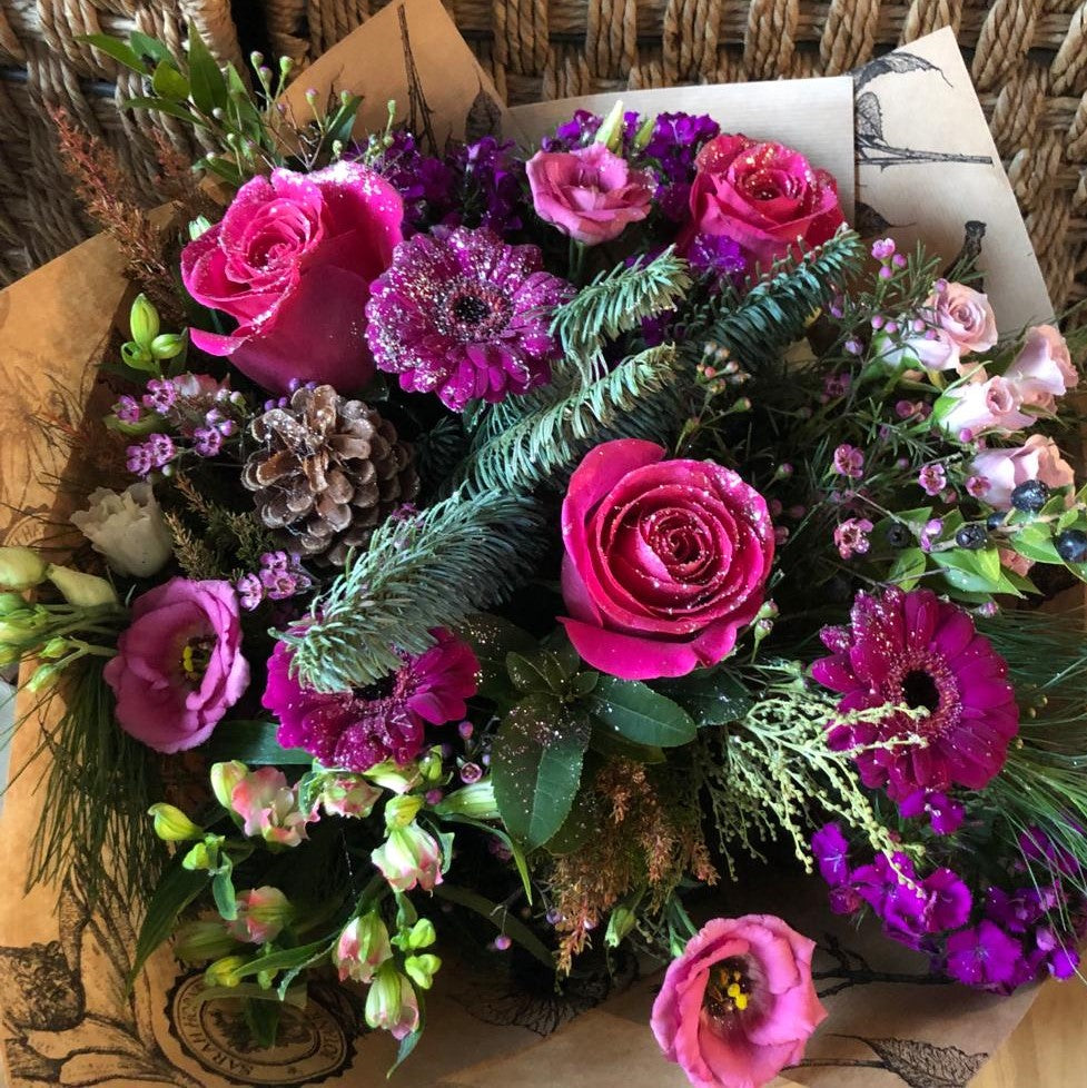 pink roses and purples flowers sprinkled with glitter.