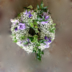gypsophillia with purple and white flower funeral wreath