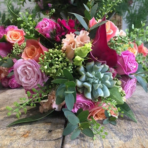 peach, pink. cerise flowers with foliage 